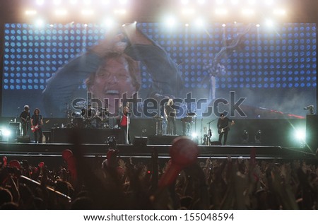 RIO DE JANEIRO, BRAZIL - SEPTEMBER 20: Fans sing along with Jon Bon Jovi, lead singer of the US rock band Bon Jovi, during their performance at the Rock in Rio 2013 concert, on September 20, 2013 in Rio de Janeiro, Brazil.