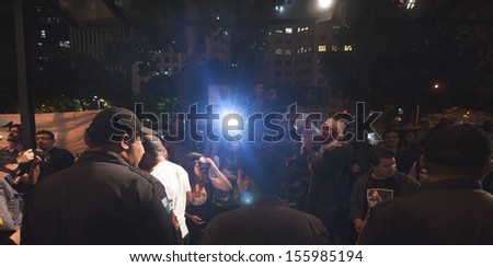 RIO DE JANEIRO, BRAZIL - SEPTEMBER 26: Protestors face the police during the Rio International Film Festival on September 26, 2013 in Rio de Janeiro, Brazil.