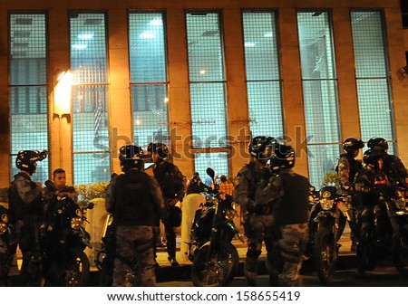 RIO DE JANEIRO, BRAZIL - OCTOBER 15: Anti- Riot police battalion secure the United States Consulate building attacked during a protest in support the teacher\'s strike as the annual October 15 Teachers\' Day holiday came to a violent conclusion on October 1