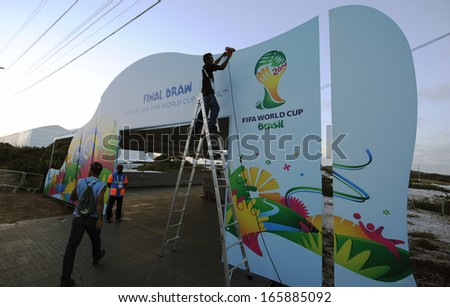 COSTA DO SAUIPE, BRAZIL:04 DEC 2013:  a worker puts the final touch at the FIFA Final Draw tent on Costa do Sauipe  on 04 December 2013 preparing the FIFA 2014 World Cup Final Draw next December 06th.