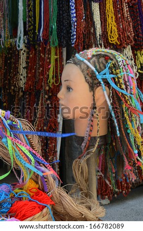 SALVADOR, BAHIA, BRAZIL:09 DEC 2013: a doll\'s head displays the traditional ornament for hair \