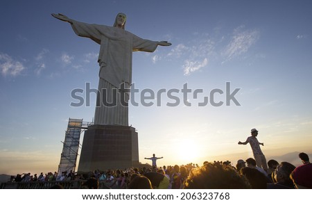 Rio de Janeiro, 16 July 2014- Tourist pose in front of the Christ the Redeemer statue atop the Corcovado hill in Rio de janeiro, Brazil.