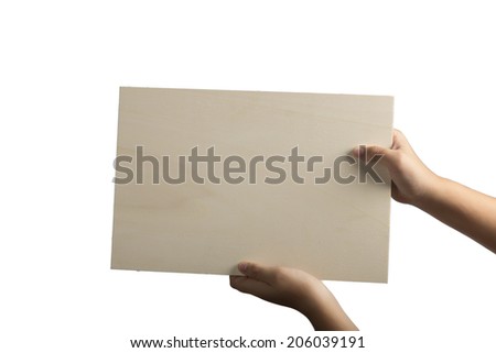 Young caucasian hands holding a light color plywood square blank signboard isolated on white background. There are no elements to distract viewer from reading any  message written on the sign