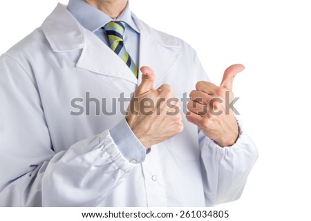 Man dressed with medical white coat, light blue shirt and regimental tie is making the sign of the horns, a gesture meaning luck, superstition, against evil eye