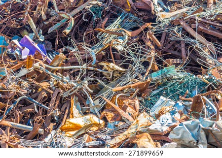 a chaotic collection of ferrous rusty reminds of the desolation of consumerism and the problem of waste disposal