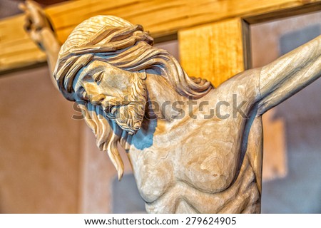A wood carved statue  of the Crucifixion of Jesus Christ