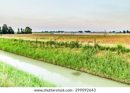 irrigation systems in modern agriculture - the modern machinery for irrigation related to ancient irrigation canals allow more effective management of water