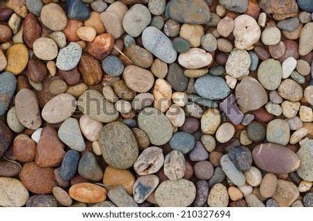 Multicolor of river stones background, close up.
