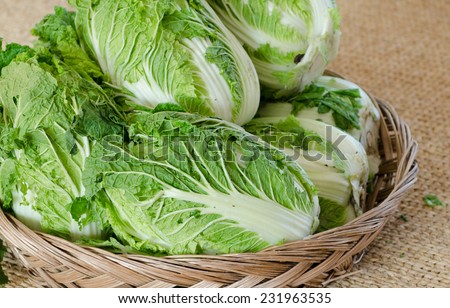Fresh Chinese cabbage in the basket on sack background