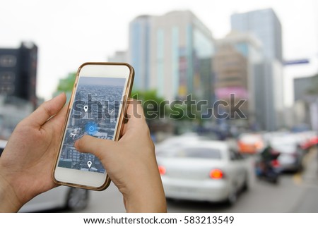 Using mobile smart phone search location on satellite navigation application over traffic transportation in city, internet of things, satellite navigation application on phone, smart journey concept