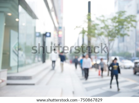 Blurred background of traffic on the road and people walking on sidewalk,  business area in city, Seoul Korea, perspective. - Stock Image - Everypixel