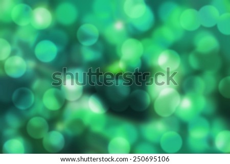 light green/emerald bokeh background. abstract blurred lights