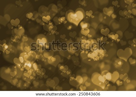dark yellow bokeh heart background. abstract blurred lights