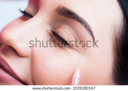 Botox face, face model close-up, brunette girl
