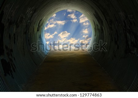 A dark tunnel with light at the end.
