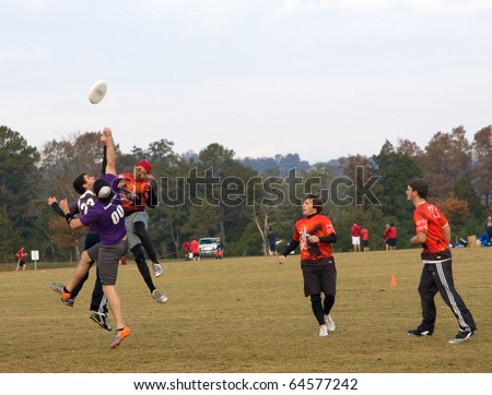 KNOXVILLE, TN - NOVEMBER 6: Ultimate Frisbee players reach for the disc at the Dave Baldwin Memorial Tournament, November 6, 2010, Victor Ashe Park, Knoxville, Tennessee