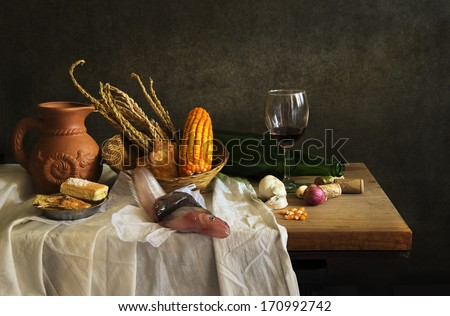 Still life food with fish  and  red wine on wooden table and bread
