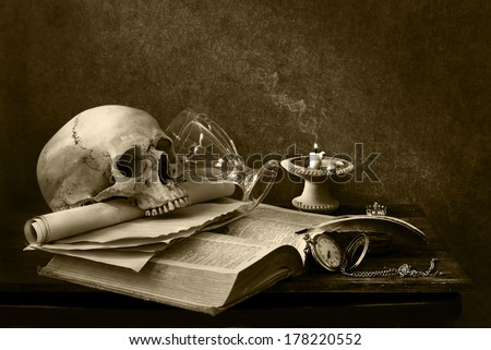 still life art photography on human skull with open book