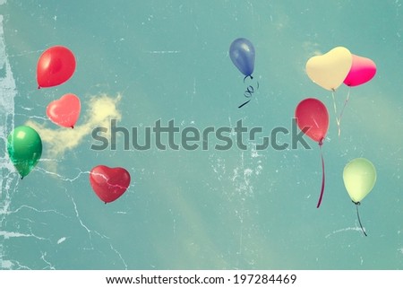 vintage tattered photo paper heart balloon on blue sky concept of love in summer and valentine