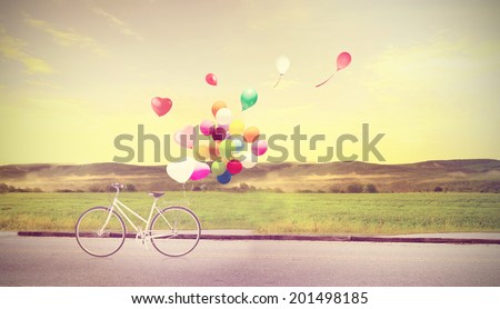 bicycle vintage with heart balloon on beach blue sky concept of love in summer and wedding