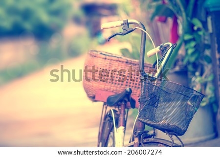 Detail of a Vintage Bicycle Resting in the countryside Street (vintage color toned image)