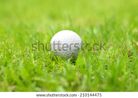 old golf ball on grass field