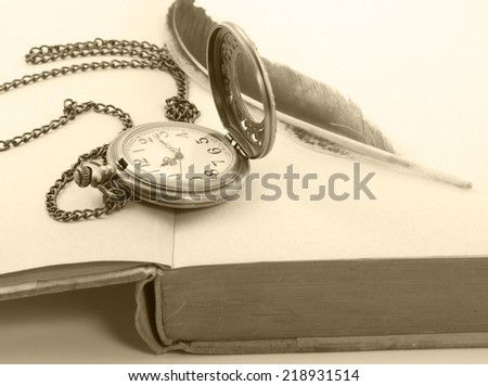 Vintage with antique pocket watch, and old book  ,quill