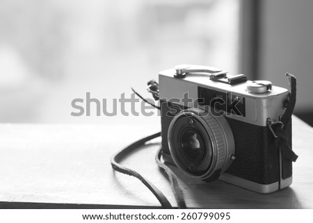 black and white image of film cameras that had been popular in the past