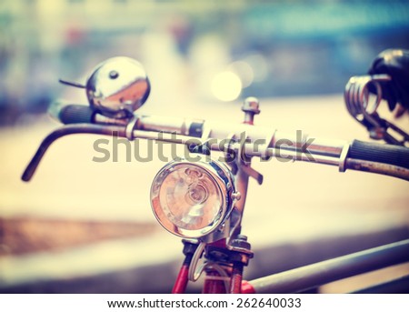 Detail of  headlight old bicycle with blurred backgroung, vintage and retro style