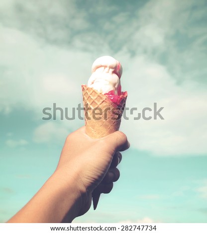 girl hand holding ice cream with retro filter effect