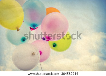 vintage colorful balloon on blue sky concept of happy birth day, paper art texture