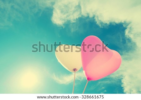 vintage heart balloon on blue sky concept of love in summer and valentine, wedding honeymoon