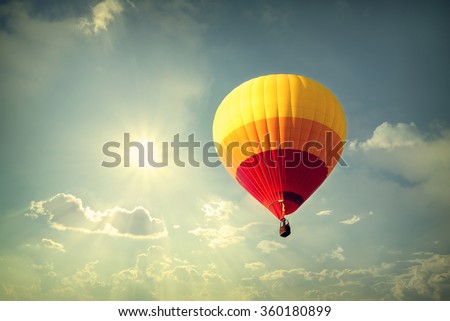 Hot air balloon on sky with cloud, vintage retro filter effect