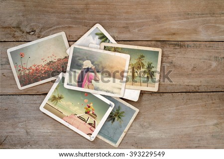 Summer photo album on wood table. instant photo of film camera - vintage and retro style