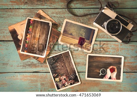 Merry christmas (xmas) photo album on old wood table. paper photo of polaroid camera - vintage and retro style