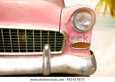 Journey of holiday - front of pink vintage classic car parked side beach in summer