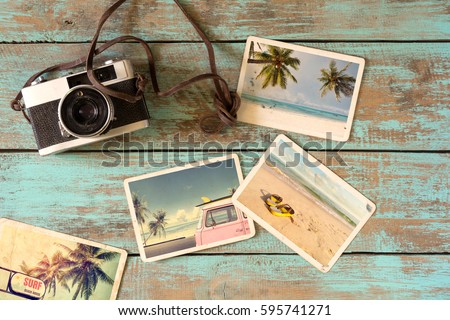 Summer photo album of journey in summer surfing beach trip on wood table. instant photo of vintage film camera - vintage and retro style