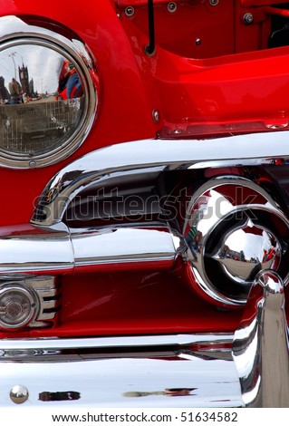 stock photo Classic candy apple red vintage car headlight