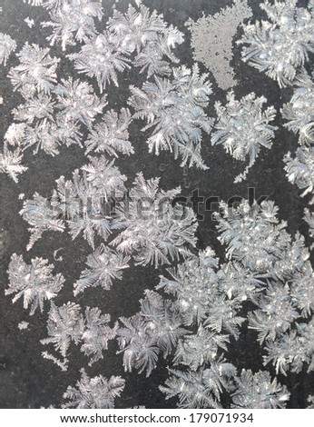 Photograph Frost patterns on glass balconies. The town of Angarsk, Irkutsk region in Eastern Siberia. Sunny day. Winter.