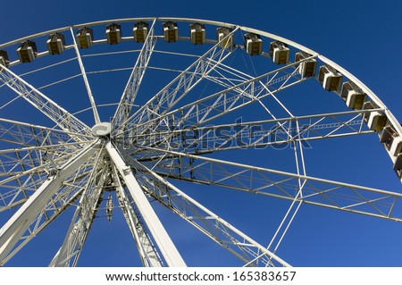 Ferris wheel. Attraction in Paris.