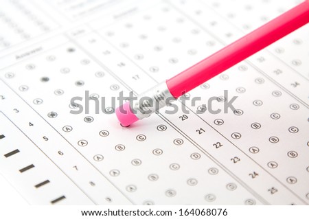 pink eraser on a pencil, and the answers to the test