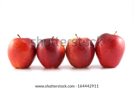 Four fresh red apples on white background