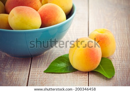 Juicy  fresh peaches on wooden table