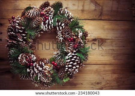 Christmas wreath on a rustic wooden front door