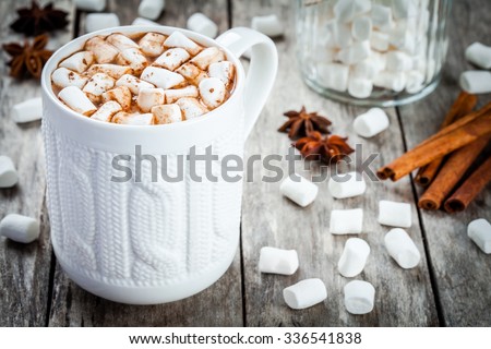 hot  chocolate with marshmallows on wooden table