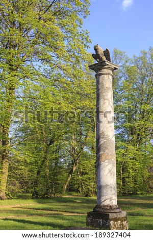 The owl statue, garden in french style in Nieborow, Poland