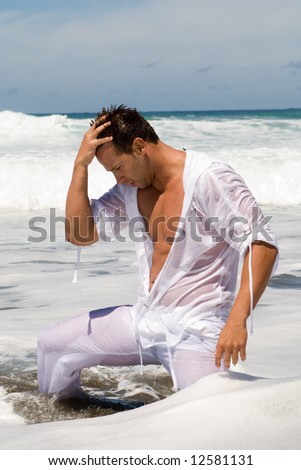 stock photo man in the seaside with wet clothes