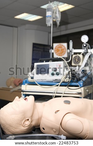 Defibrillator on a dummy for practisse