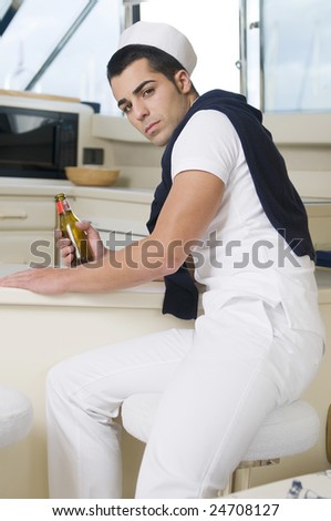 sailor man wearing white navy clothes into a yacht