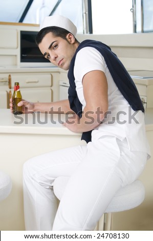 sailor man into a yacht wearing navy white clothes